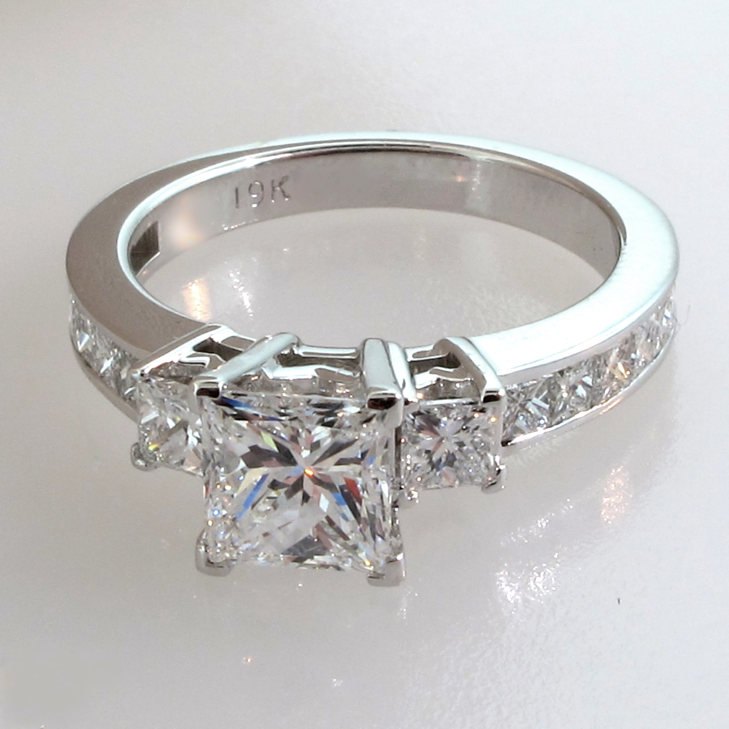 Engagement Ring Channel-Set Princess-Cut center stone with 2 side diamonds 19k white gold