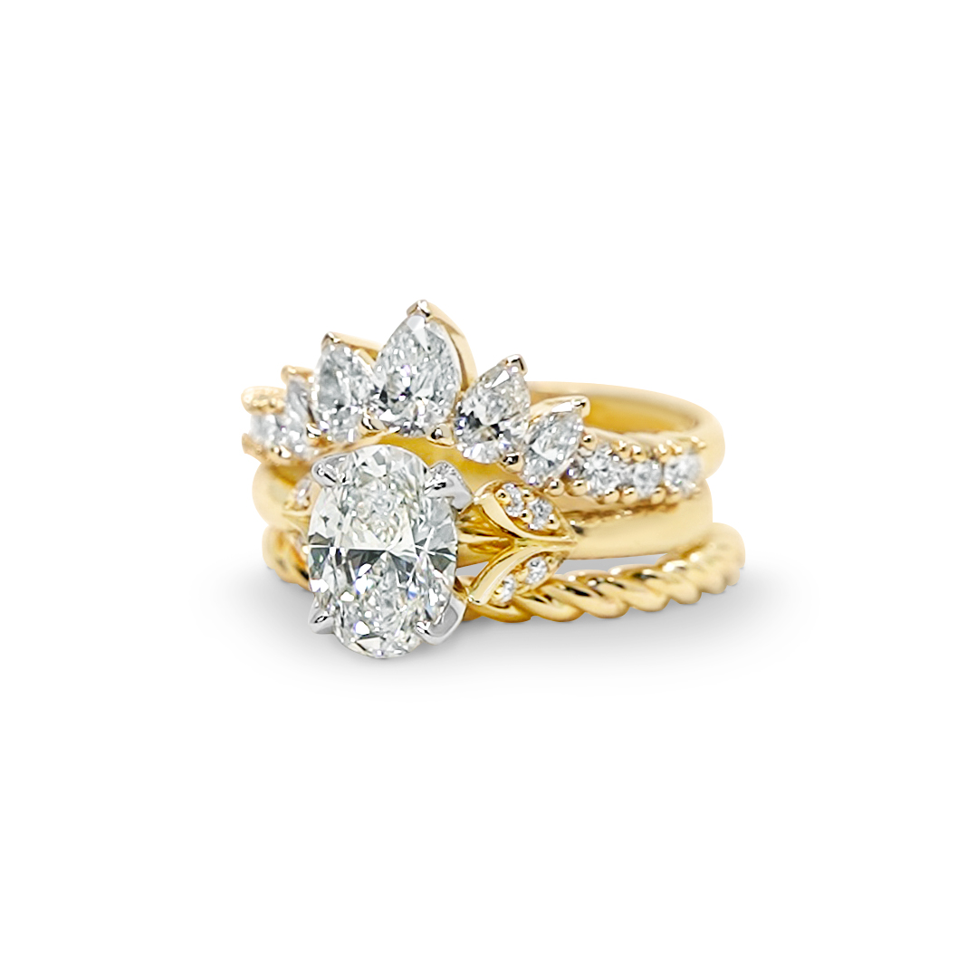 yellow gold diamond engagement ring and diamond wedding band with twisted gold band